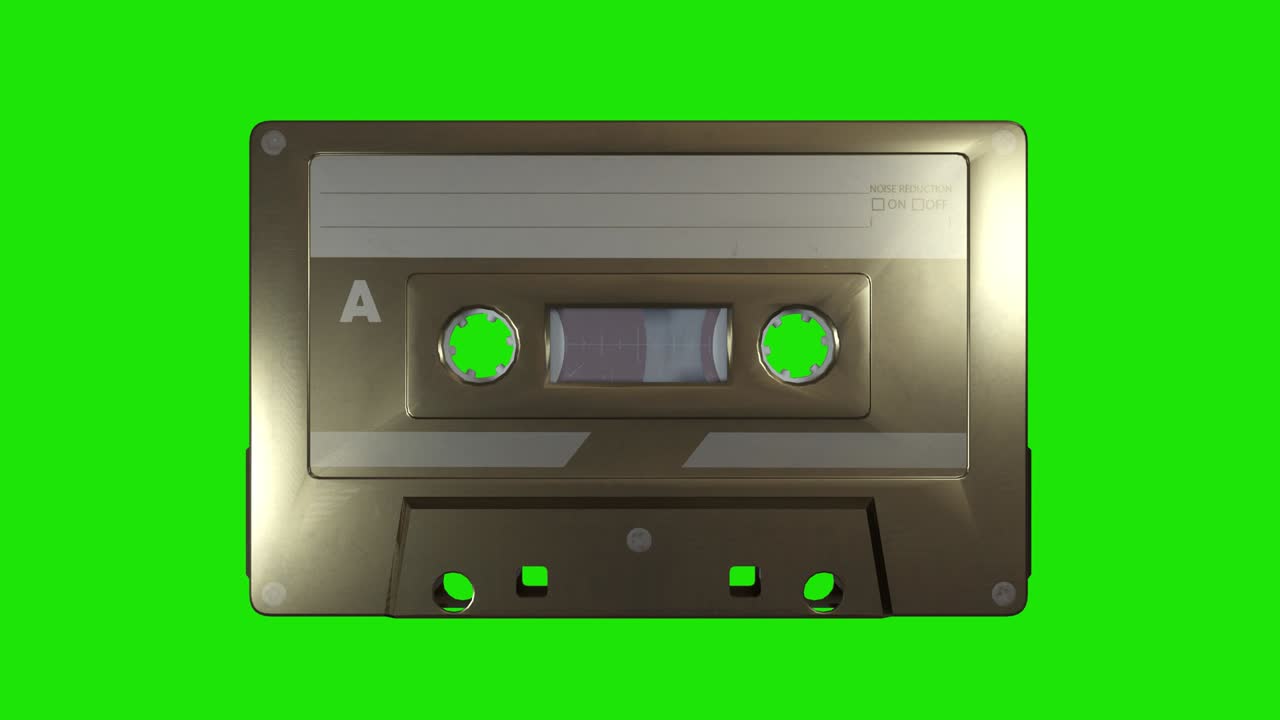 Una cassetta musicale dorata su sfondo green screen