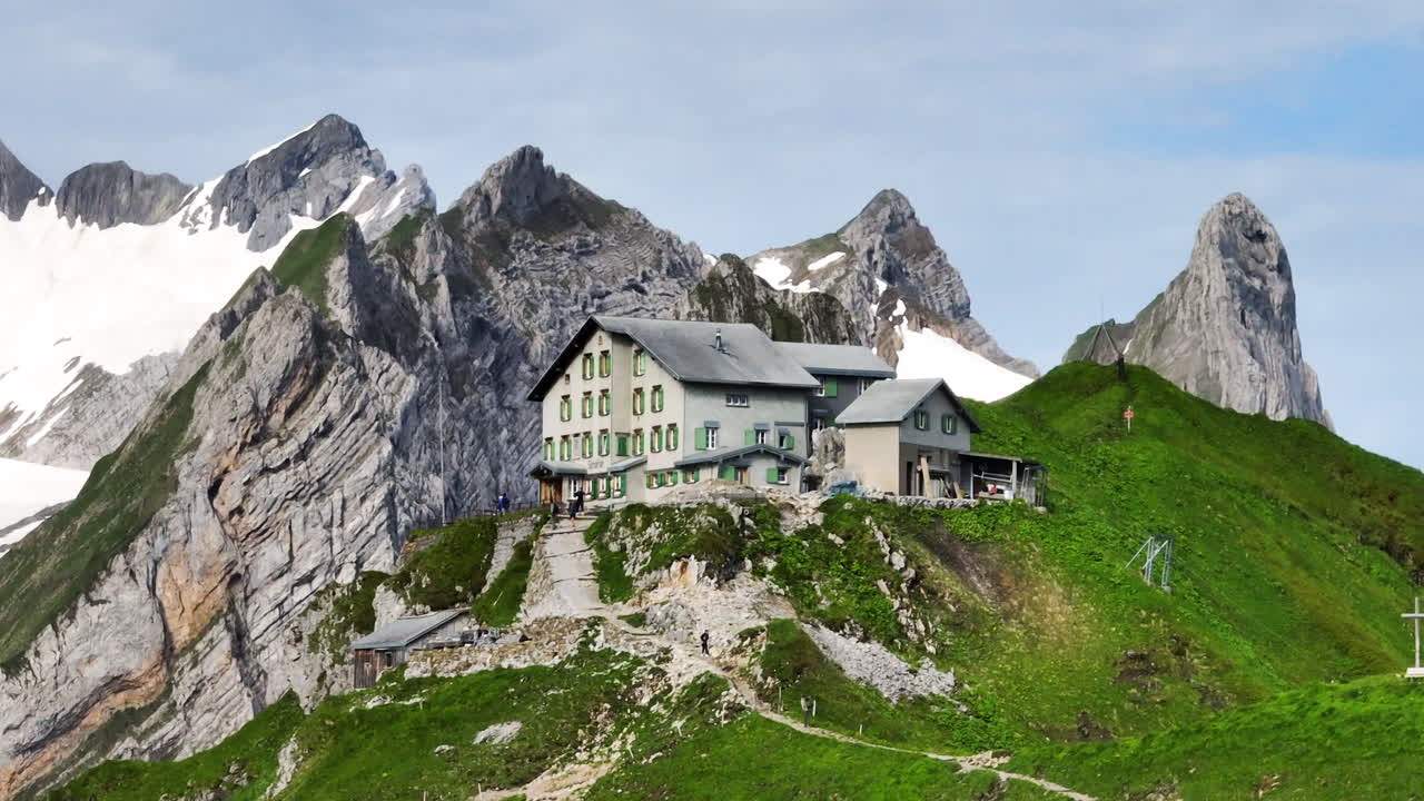 Schafler Mountain Cabin With Rocky Mountain Views In The Early Morning In Switzerland. - aerial shot