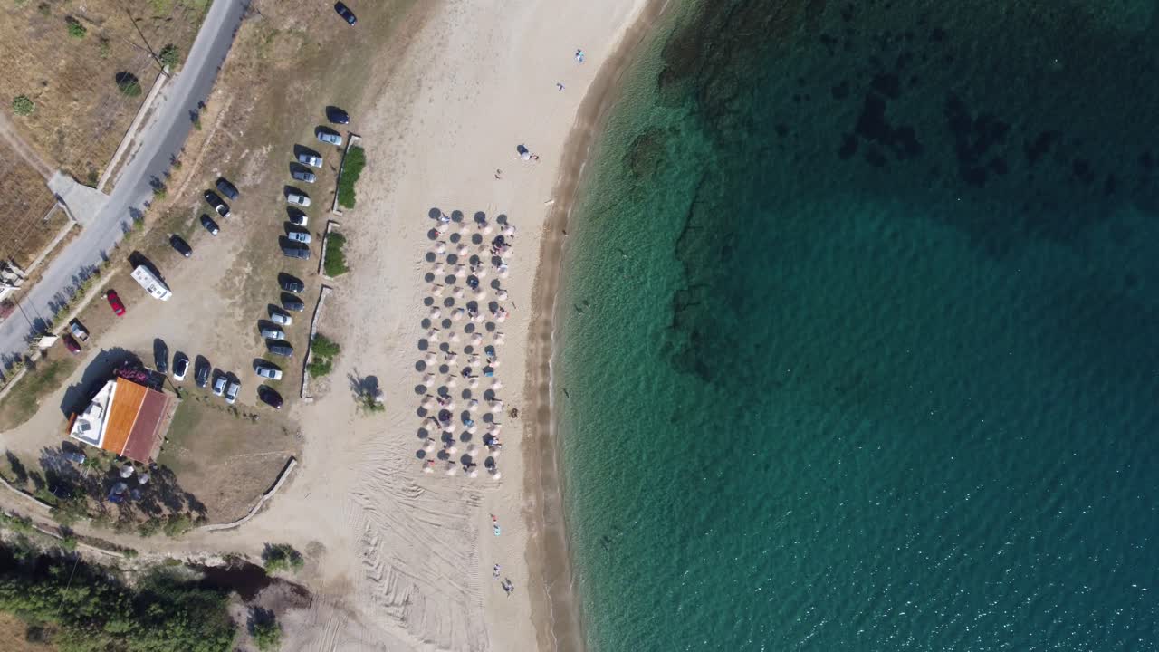 Summer in the Aegean | Top view drone shot of sandy beach in the Aegean sea, Greece | 4K