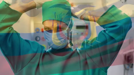 animation of flag of ecuador waving over surgeon in operating theatre