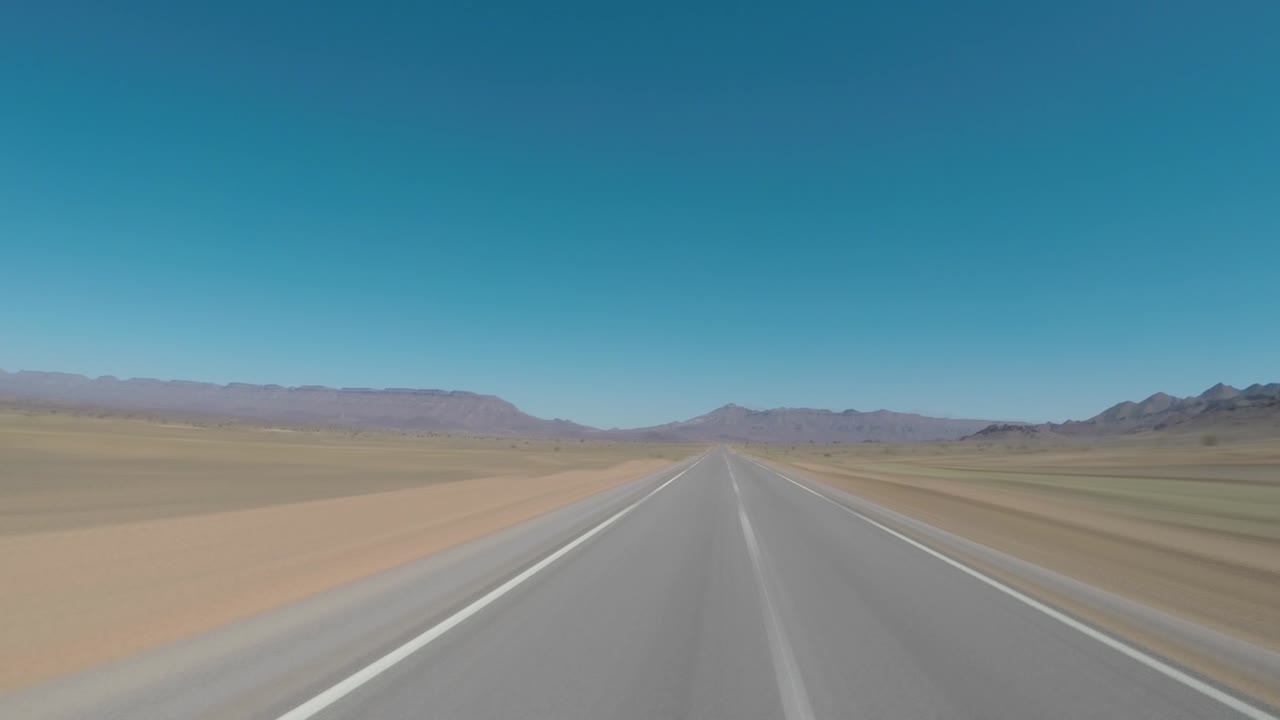 Seamless looping motion blure POV driving shot on an empty road