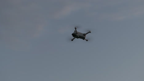 drone flying under dark sky