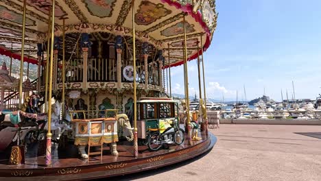 a carousel spinning near monte carlo harbor