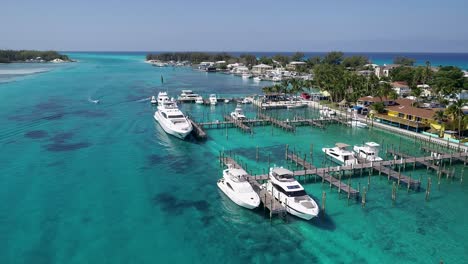 a 4k drone shot of the bimini blue water marina, in north bimini, a small island chain found off the coast of the bahamas