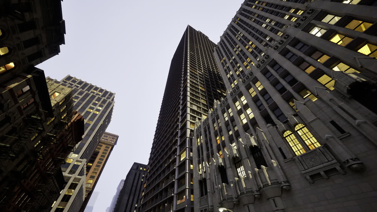Skyscrapers rise above the city streets during twilight in an urban setting