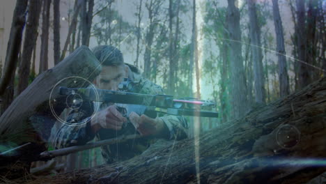 camouflaged man crouching behind log in pine forest, with animated technology hud guiding shot