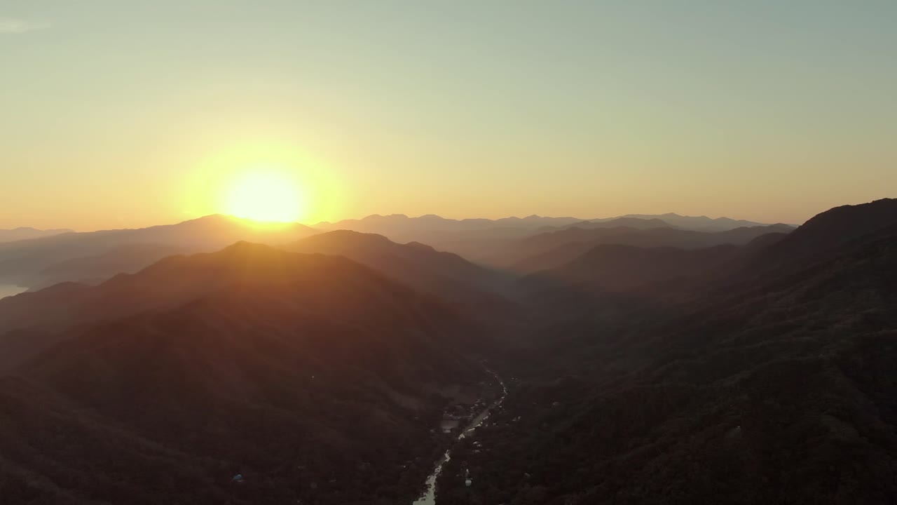 Dramatic View Of Golden Sunrise Over Ridges In Yelapa Town, Jalisco, Mexico. Aerial Wide Shot