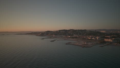 aerial view of marseille in sunset
beautiful drone shot of marseille in sunset alongside the sea and beach