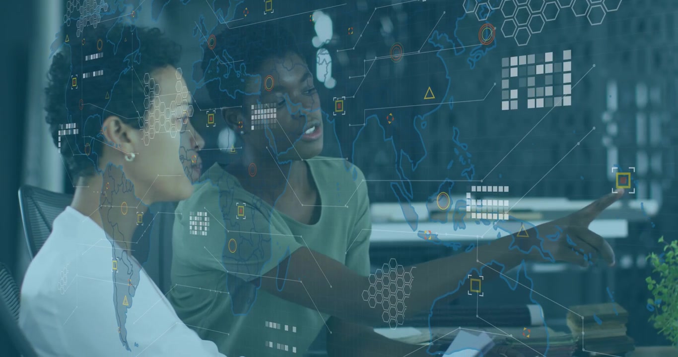 Animation of data processing over world map against african american female colleagues discussing