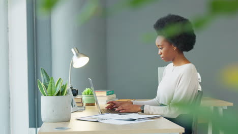 female law student typing an assignment report