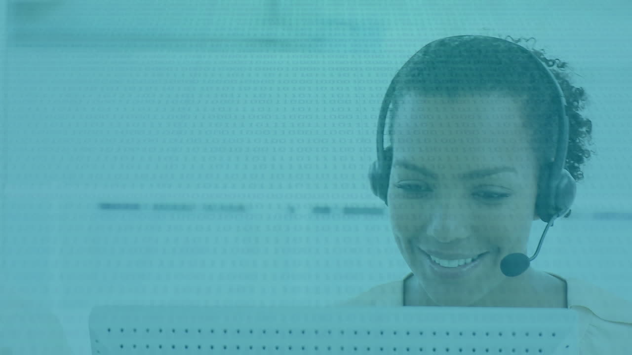 Animation of biracial woman wearing headset, using computer over data recording