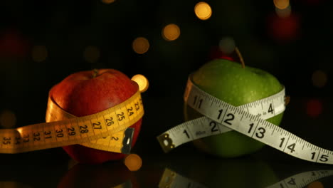 apples wrapped in measuring tape