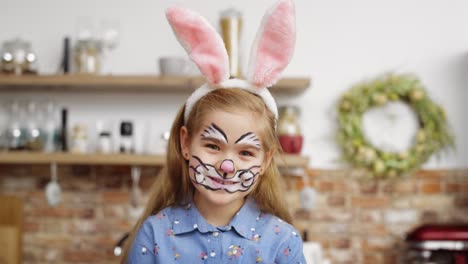 portrait video of cute playful girl dressed as easter bunny