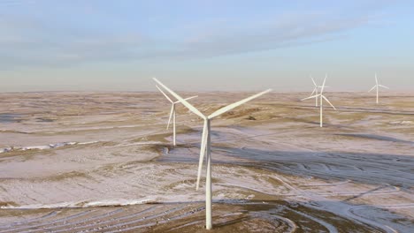 Aerial-shots-of-wind-turbines-on-a-cold-winter-afternoon-in-Calhan,-Colorado