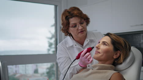 hardware professional facial treatment making by dermatologist in clinic closeup