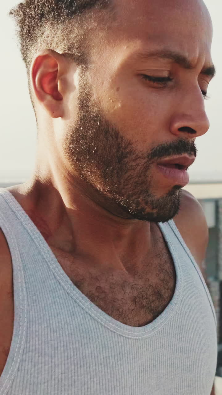 Man with beard in tank top