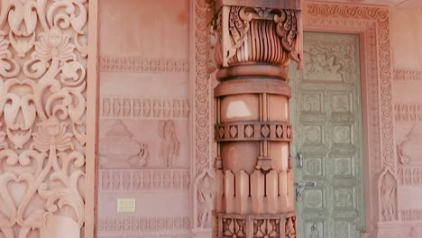 artistic-hand-carved-red-stone-jain-temple-at-morning-from-unique-angle-video-is-taken-at-Shri-Digamber-Jain-Gyanoday-Tirth-Kshetra,-Nareli-Jain-Mandir,-Ajmer,-Rajasthan,-India