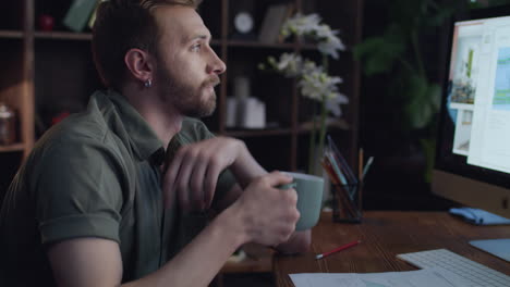 creative designer drinking coffee to cheer up while working in studio