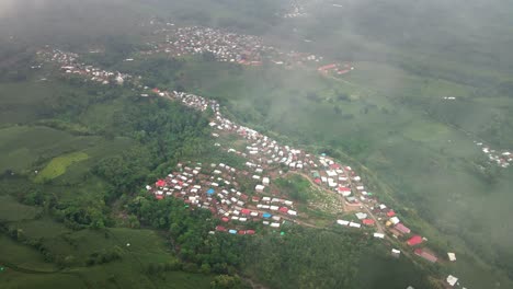 aerial shot of cultural remote village rumah adat kampung uma leme deep into the mountains of central sumbawah, indonesia