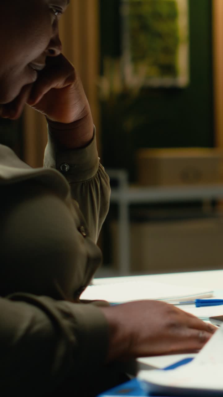 Vertical Video Black woman distressed about stock market trends going down