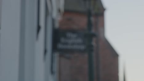 focus rack to old english bookshop sign in historical castle town