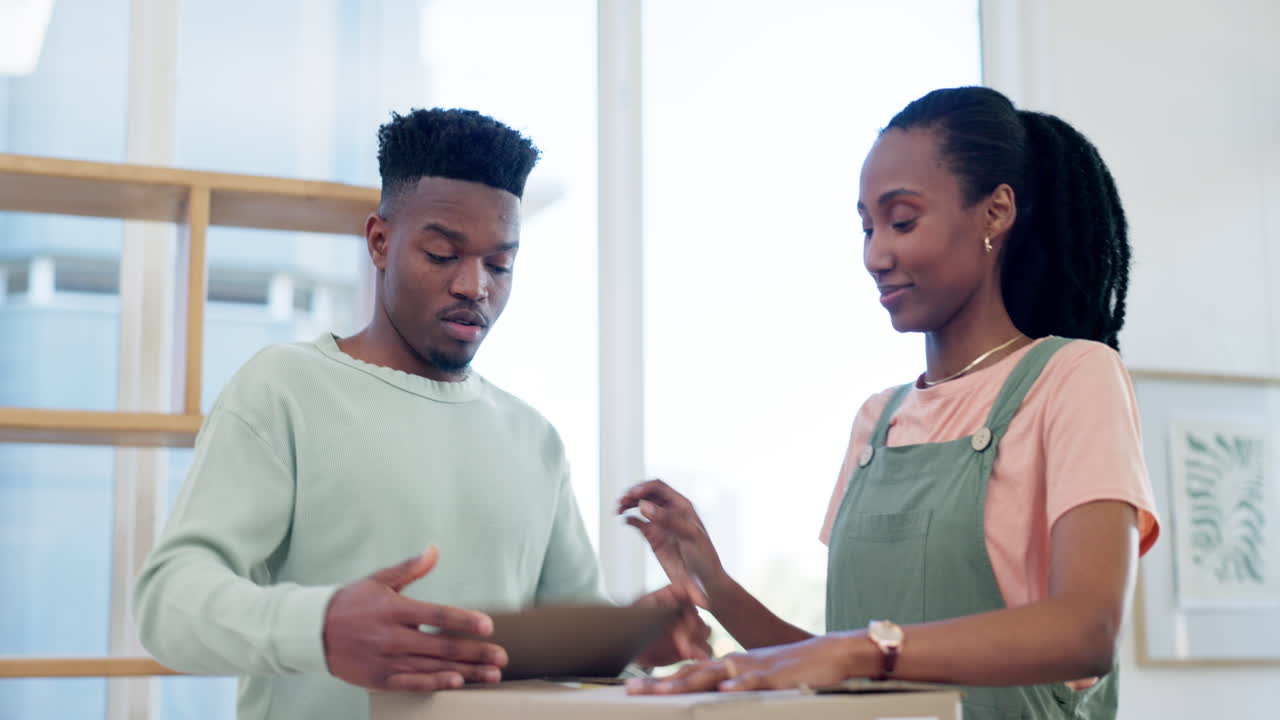 Couple, high five and packing box