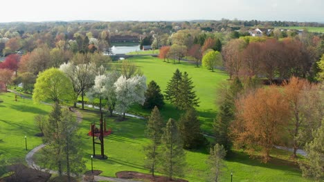 beautiful aerial of walking trail, path through park in full bloom during spring season