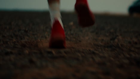 running feet in red shoes