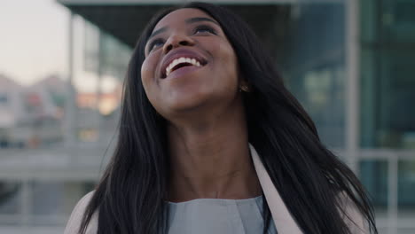 portrait of happy african american woman in city beautiful corporate intern
