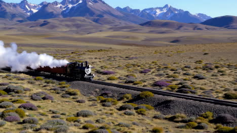 vintage steam train through a mountainous desert landscape