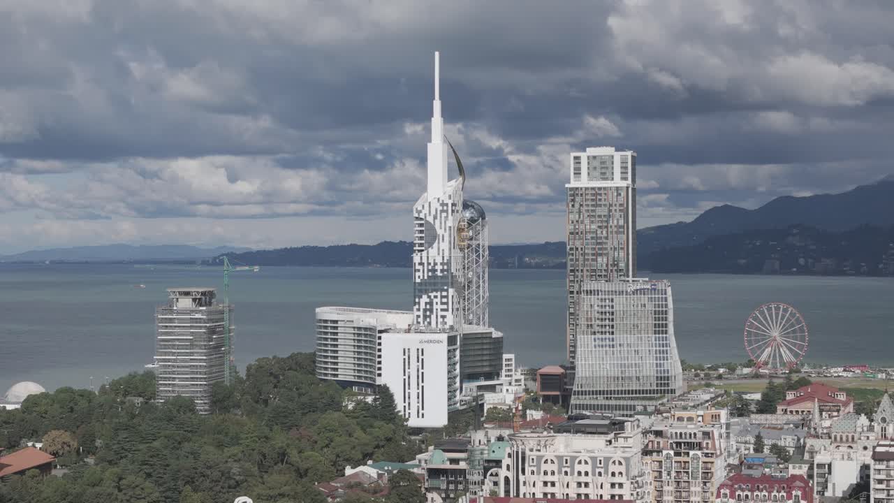 Cinematic daytime drone footage of Batumi skyline and skyscrapers.