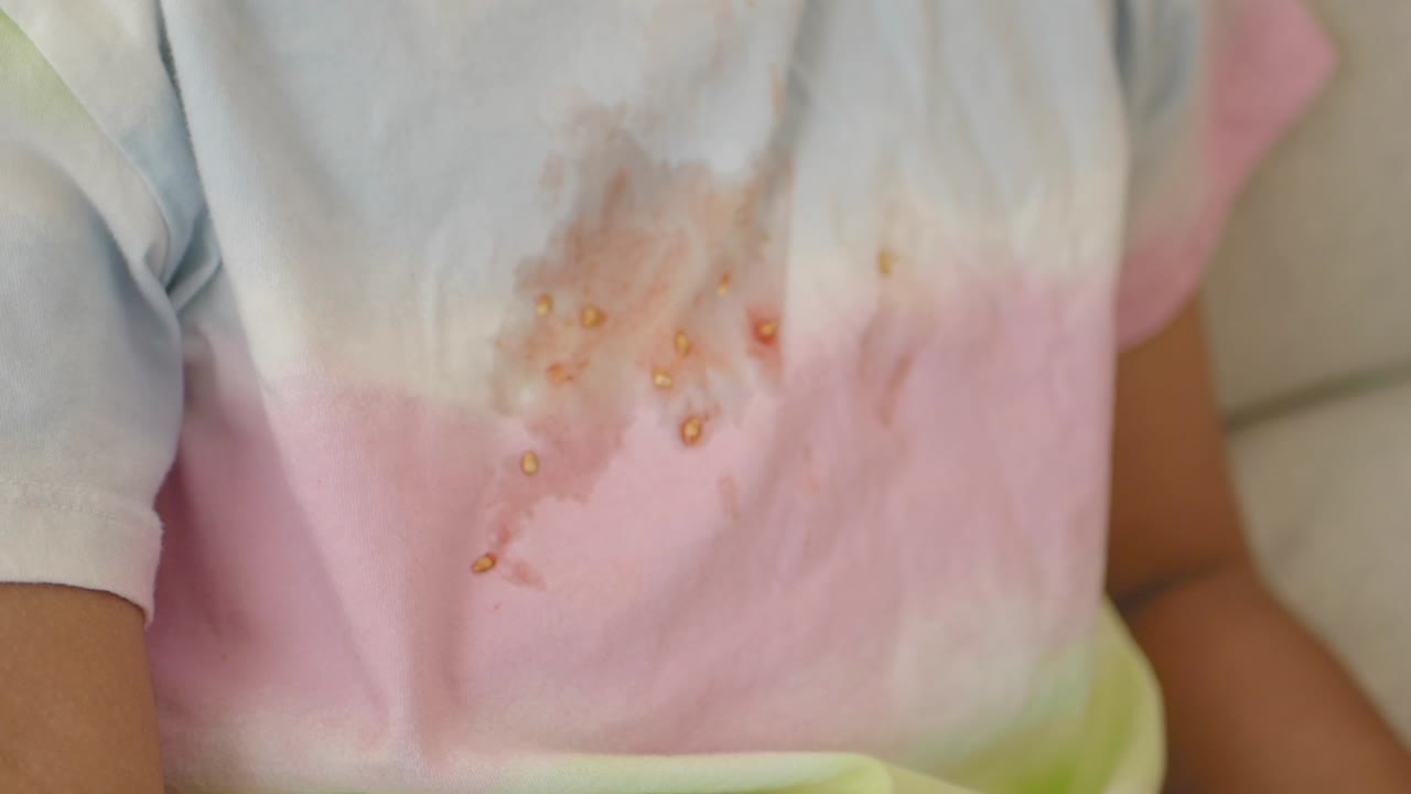 A shirt with a tomato sauce stain