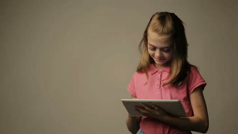 teen girl uses a gadget, isolated on background
