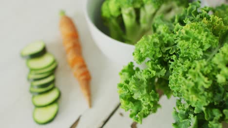 video of fresh vegetables with copy space over wooden background