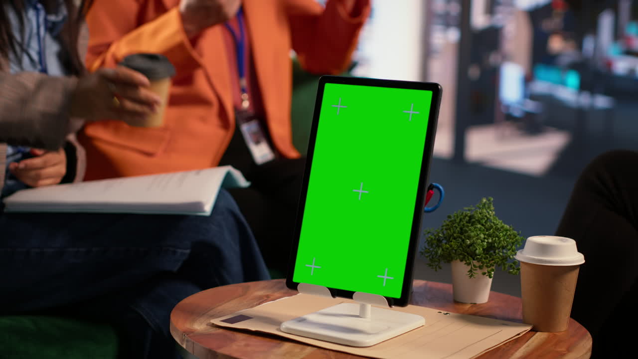Business Meeting with Tablet and Green Screen