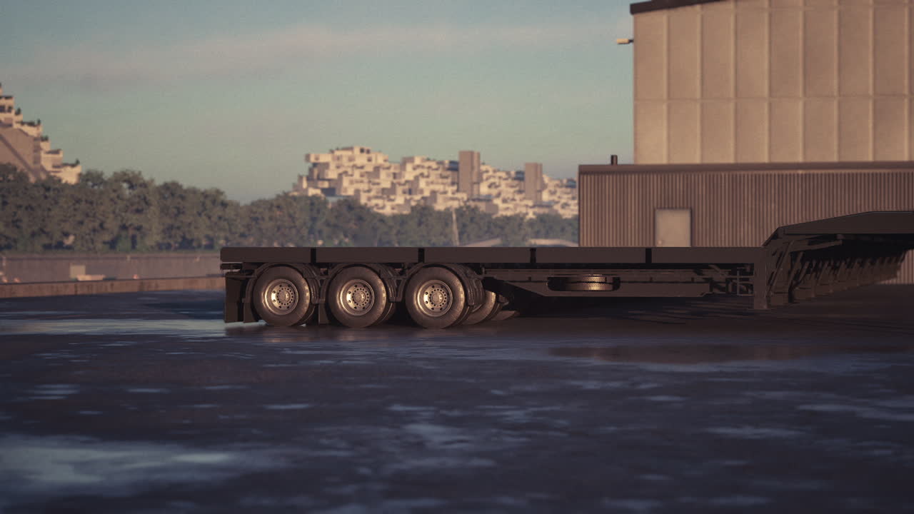 콘크리트 패드 에 주차 된 검은색 플래트 베드 준 트레일러 트럭