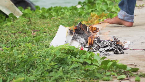 joss paper burning as traditional offering ritual in buddhist religion