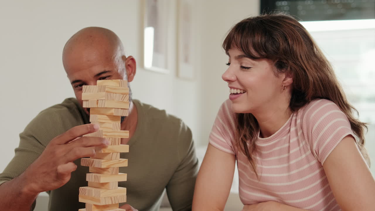 Couple Playing Jenga at Home