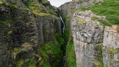 drone shot of glymur waterfall in iceland