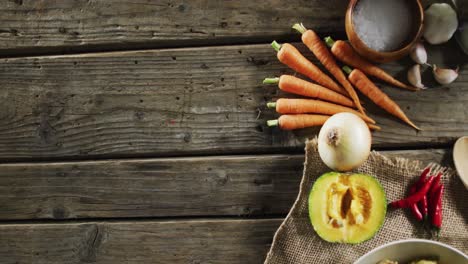 Overhead-close-up-view-of-multiple-food-ingredients-on-wooden-surface