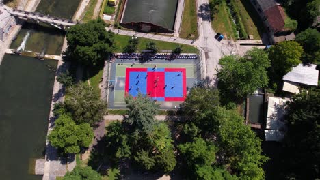 aerial view of a street basketball game in a park