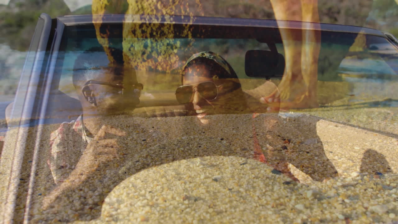 Driving convertible car, smiling couple with animation of beach and ocean scene