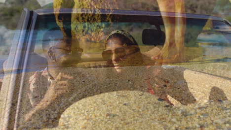 driving convertible car, smiling couple with animation of beach and ocean scene