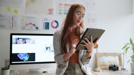 Woman working with tablet in office