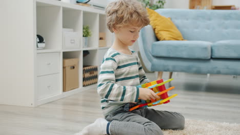 child playing with wooden puzzle blocks