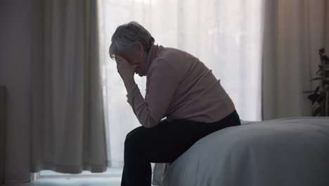 stress, depression and sad old woman in bedroom