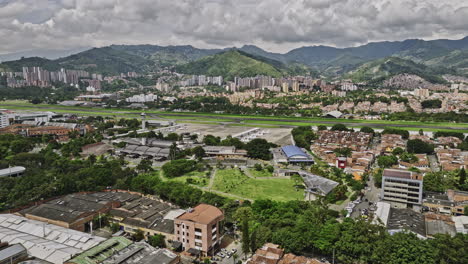 medellin colombia aerial v16 low flyover and around santa fe and campo amor guayabal capturing domestic airport and urban cityscape with mountainous background - shot with mavic 3 cine - november 2022