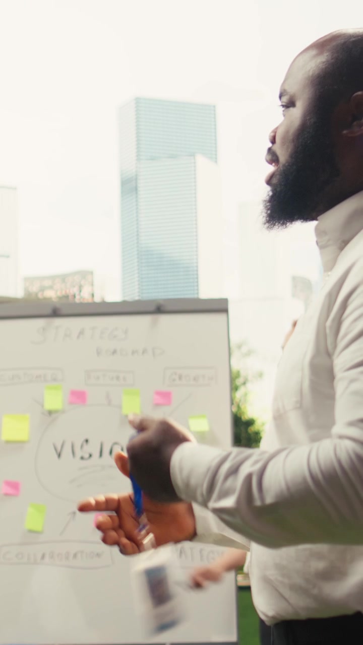Vertical Video Close up handshake between professionals during outdoor collaborative planning