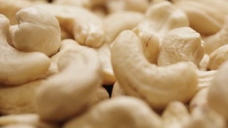 smooth camera movement over a handful of cashew nuts.