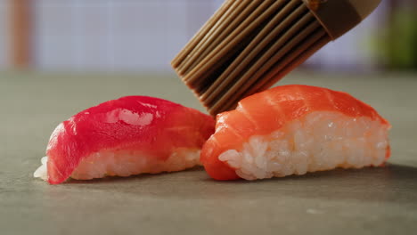 preparing salmon and tuna nigiri sushi